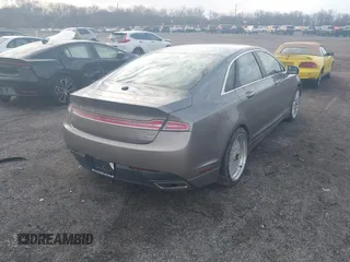 2015 Lincoln MKZ z VIN 3LN6L2J98FR620089, wystawiony jako IAAI lot #41805555 z przebiegiem Nie podano mil oraz . Historia ofert i sprzedaży dostępna na DreamBid. Obrazek 4.