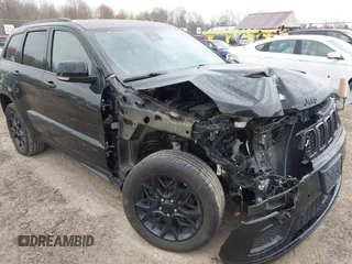 2021 Jeep Grand Cherokee 80th Anniversary with VIN 1C4RJFBG7MC828116, listed as a IAAI auction lot 42118355 with 57,240 mi miles and . Bid and sale history available at DreamBid. Image 1.
