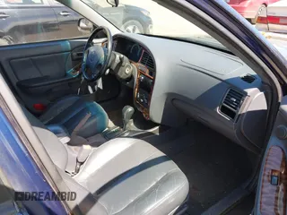 2003 Hyundai Elantra GLS z VIN KMHDN45D93U648323, wystawiony jako IAAI lot #42023382 z przebiegiem 213 540 mil mil oraz . Historia ofert i sprzedaży dostępna na DreamBid. Obrazek 5.