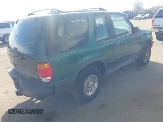 1999 Ford Explorer Sport with VIN 1FMYU22X2XUB19728, listed as a IAAI auction lot 41642358 with 128,788 mi miles and . Bid and sale history available at DreamBid. Image 4.