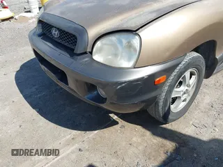 2004 Hyundai Santa Fe GLS z VIN KM8SC73EX4U814067, wystawiony jako IAAI lot #40404373 z przebiegiem 182 101 mil mil oraz . Historia ofert i sprzedaży dostępna na DreamBid. Obrazek 6.