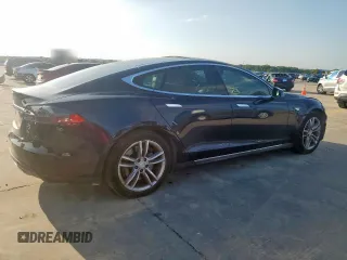 2014 Tesla Model S 60 с VIN 5YJSA1H16EFP50018, выставлен на аукционе Copart как лот 64372605 с пробегом 165 910 миль миль и Списание • Salvage title. История ставок и продаж доступна на DreamBid. Изображение 3.