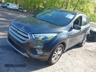 2017 Ford Escape SE z VIN 1FMCU0GDXHUB66813, wystawiony jako IAAI lot #42056150 z przebiegiem 86 915 mil mil oraz . Historia ofert i sprzedaży dostępna na DreamBid. Obrazek 22.
