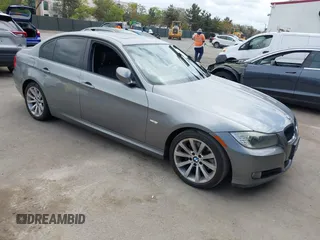2011 BMW 3 Series 328i with VIN WBAPH5G52BNM84035, listed as a IAAI auction lot 42046301 with 165,418 mi miles. Bid and sale history available at carsss.com. Image 1.