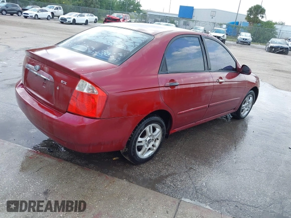 2004 Kia Spectra LX with VIN KNAFE121545021648, listed as a IAAI auction lot 41842471 with 211,436 mi miles. Bid and sale history available at carsss.com. Image 4.