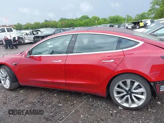 2018 Tesla Model 3 Long Range Battery with VIN 5YJ3E1EA6JF052659, listed as a IAAI auction lot 42093903 with 49,255 mi miles and . Bid and sale history available at DreamBid. Image 15.