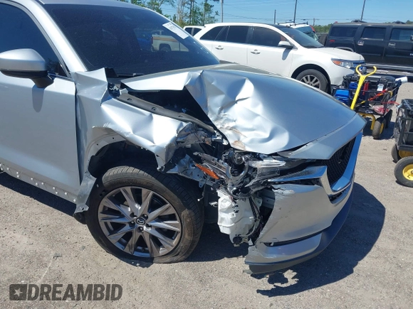 2019 Mazda CX-5 Grand Touring with VIN JM3KFADM1K1606082, listed as a IAAI auction lot 41875878 with 66,089 mi miles. Bid and sale history available at carsss.com. Image 6.
