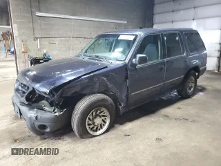 2000 Ford Explorer XLS z VIN 1FMZU72X7YUA71727, wystawiony jako Copart lot #51416935 z przebiegiem 163 005 mil mil oraz Szkody całkowita. Historia ofert i sprzedaży dostępna na DreamBid. Obrazek 1.