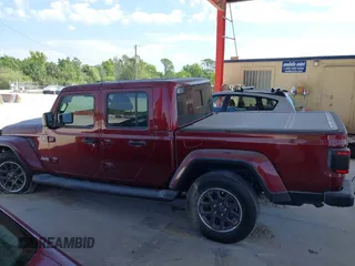 2021 Jeep Gladiator Overland z VIN 1C6HJTFGXML553983, wystawiony jako IAAI lot #41903068 z przebiegiem 54 386 mil mil oraz . Historia ofert i sprzedaży dostępna na DreamBid. Obrazek 14.
