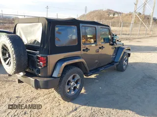 2017 Jeep Wrangler Unlimited Sahara with VIN 1C4BJWEG9HL507908, listed as a IAAI auction lot 41880209 with 99,773 mi miles. Bid and sale history available at carsss.com. Image 4.