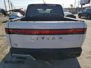 2022 Rivian R1T Adventure z VIN 7FCTGAAA9NN014280, wystawiony jako Copart lot #49723355 z przebiegiem 28 601 mil mil oraz Szkody całkowita. Historia ofert i sprzedaży dostępna na DreamBid. Obrazek 6.