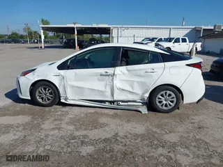 2022 Toyota Prius L Eco with VIN JTDKAMFUXN3163123, listed as a IAAI auction lot 41666679 with 68,026 mi miles. Bid and sale history available at carsss.com. Image 14.