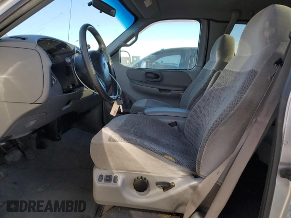 1999 Ford F-150 XL с VIN 1FTRX08L3XKA96271, выставлен на аукционе Copart как лот 49238415 с пробегом 168 477 миль миль и Списание • Salvage title. История ставок и продаж доступна на DreamBid. Изображение 7.