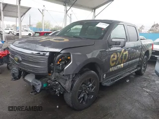 2022 Ford F-150 Lightning Pro z VIN 1FTVW1EL8NWG14070, wystawiony jako IAAI lot #41776980 z przebiegiem 14 812 mil mil oraz . Historia ofert i sprzedaży dostępna na DreamBid. Obrazek 2.