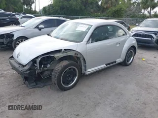 2012 Volkswagen Beetle 2.5L with VIN 3VWJX7AT9CM608065, listed as a IAAI auction lot 41864342 with 77,038 mi miles. Bid and sale history available at carsss.com. Image 2.