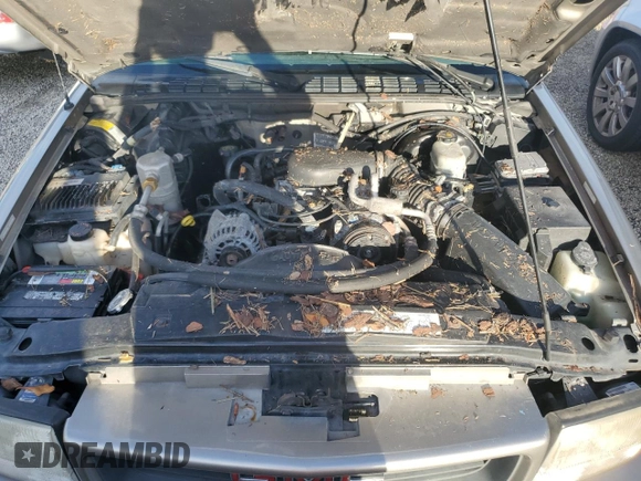 2000 GMC Sonoma SLS z VIN 1GTCS19W3Y8158978, wystawiony jako Copart lot #74180564 z przebiegiem Nie podano mil oraz Szkody całkowita. Historia ofert i sprzedaży dostępna na DreamBid. Obrazek 11.