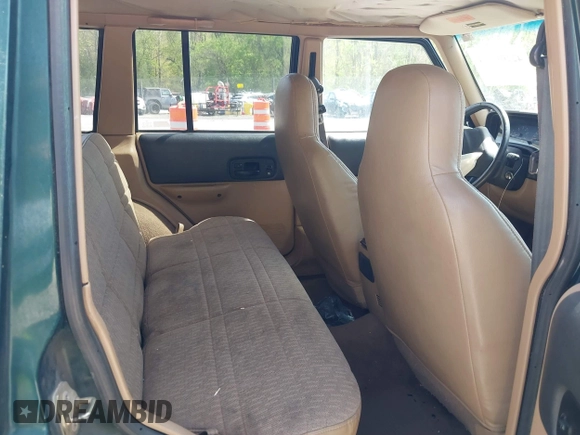 1999 Jeep Cherokee Sport with VIN 1J4FF68S7XL538831, listed as a IAAI auction lot 42101903 with 255,734 mi miles and . Bid and sale history available at DreamBid. Image 8.