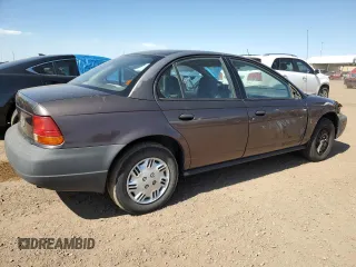 1998 Saturn SL с VIN 1G8ZH528XWZ140961, выставлен на аукционе Copart как лот 61259575 с пробегом 237 291 миль миль и Списание • Salvage title. История ставок и продаж доступна на DreamBid. Изображение 3.
