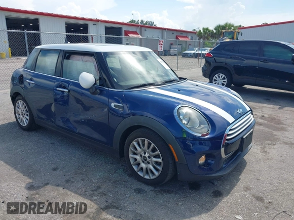 2015 MINI Hardtop 4 Door with VIN WMWXS5C51FT827510, listed as a IAAI auction lot 42365599 with 53,667 mi miles and . Bid and sale history available at DreamBid. Image 1.