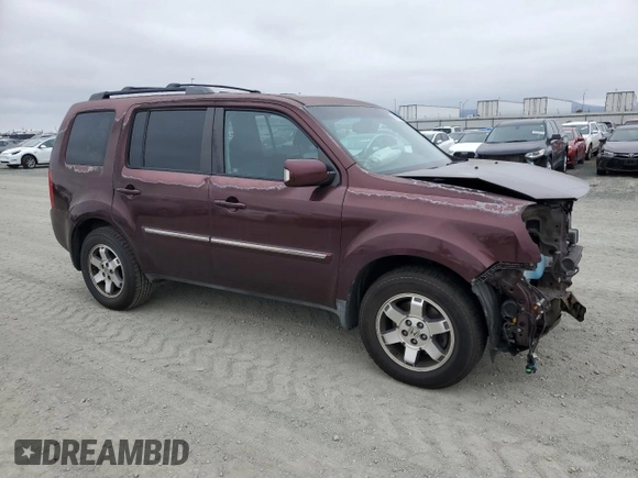 2011 Honda Pilot Touring z VIN 5FNYF3H92BB039165, wystawiony jako Copart lot #59596105 z przebiegiem 182 944 mil mil oraz Szkoda całkowita • Salvage title. Historia ofert i sprzedaży dostępna na DreamBid. Obrazek 4.