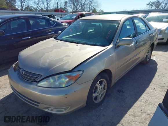 2002 Toyota Camry LE z VIN 4T1BE32K02U051709, wystawiony jako IAAI lot #41485620 z przebiegiem 232 876 mil mil oraz . Historia ofert i sprzedaży dostępna na DreamBid. Obrazek 17.