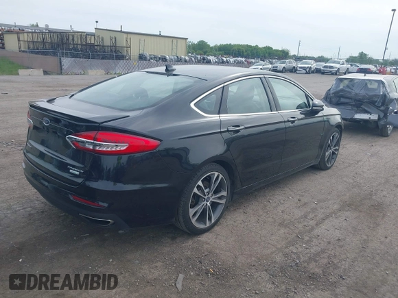 2020 Ford Fusion Titanium with VIN 3FA6P0K94LR117138, listed as a IAAI auction lot 42345819 with 88,117 mi miles and . Bid and sale history available at DreamBid. Image 4.