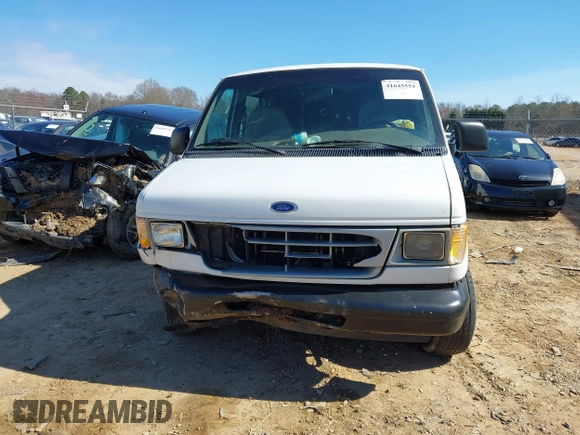 1999 Ford Econoline Cargo with VIN 1FTRE14W0XHB64440, listed as a IAAI auction lot 41645551 with 239,114 mi miles. Bid and sale history available at carsss.com. Image 12.