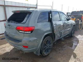2021 Jeep Grand Cherokee Laredo X with VIN 1C4RJEAG5MC824738, listed as a IAAI auction lot 41580995 with 57,923 mi miles. Bid and sale history available at carsss.com. Image 4.