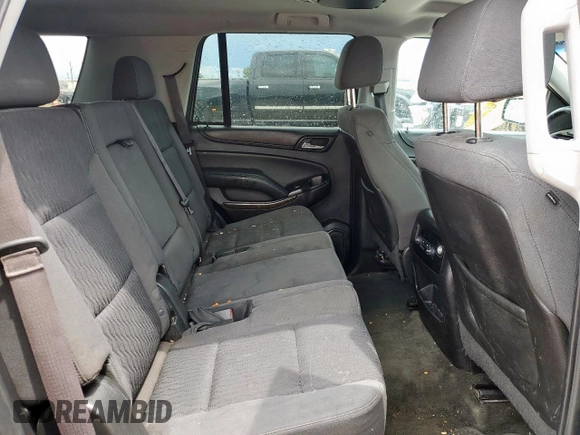 2015 Chevrolet Tahoe LS z VIN 1GNSCAKC4FR113247, wystawiony jako Copart lot #55578085 z przebiegiem 194 023 mil mil oraz Szkoda całkowita • Salvage title. Historia ofert i sprzedaży dostępna na DreamBid. Obrazek 11.
