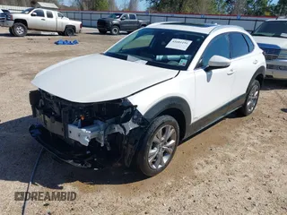 2022 Mazda CX-30 S Premium with VIN 3MVDMBDL1NM413540, listed as a IAAI auction lot 41681191 with 57,764 mi miles and . Bid and sale history available at carsss.com. Image 18.