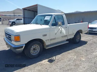 1990 Ford F-150 with VIN 2FTDF15N6LCA44303, listed as a IAAI auction lot 41981297 with 63,097 mi miles. Bid and sale history available at carsss.com. Image 2.