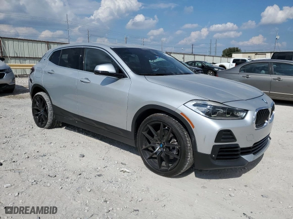 2021 BMW X2 sDrive28i with VIN WBXYH9C04M5S06770, listed as a Copart auction lot 69489874 with 27,076 mi miles and Salvage Title. Bid and sale history available at carsss.com. Image 4.