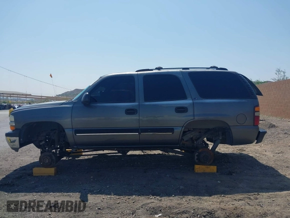 2001 Chevrolet Tahoe LS z VIN 1GNEC13T51J153677, wystawiony jako IAAI lot #42459552 z przebiegiem 201 209 mil mil oraz . Historia ofert i sprzedaży dostępna na DreamBid. Obrazek 14.