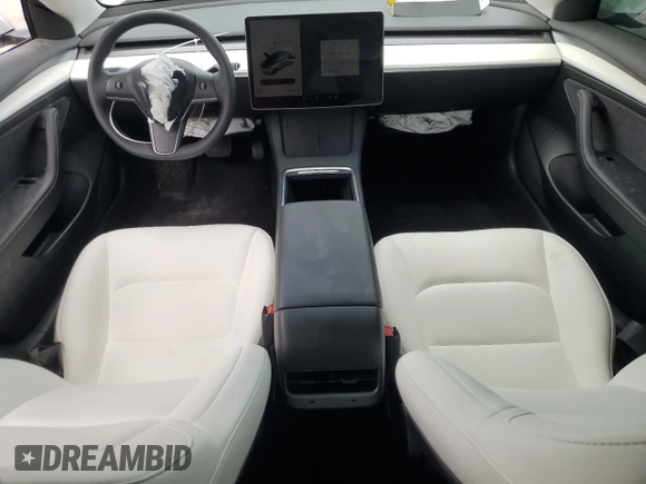 2023 Tesla Model 3 with VIN 5YJ3E1EA8PF499535, listed as a Copart auction lot 59974115 with 18,365 mi miles and Salvage title. Bid and sale history available at DreamBid. Image 8.