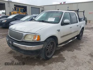 2002 Ford F-150 XLT with VIN 1FTRW07602KB74836, listed as a IAAI auction lot 42069307 with 295,692 mi miles. Bid and sale history available at carsss.com. Image 2.