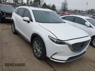 2021 Mazda CX-9 Signature with VIN JM3TCBEY7M0516772, listed as a IAAI auction lot 41553396 with 36,749 mi miles. Bid and sale history available at carsss.com. Image 1.