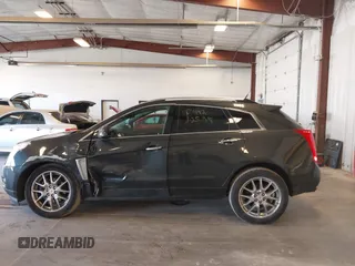 2014 Cadillac SRX Premium Collection z VIN 3GYFNGE38ES606731, wystawiony jako IAAI lot #41844450 z przebiegiem 156 541 mil mil oraz . Historia ofert i sprzedaży dostępna na DreamBid. Obrazek 14.