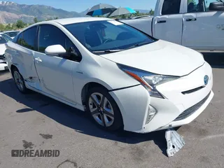 2017 Toyota Prius Two with VIN JTDKARFUXH3536565, listed as a IAAI auction lot 42374515 with 125,240 mi miles and . Bid and sale history available at DreamBid. Image 1.