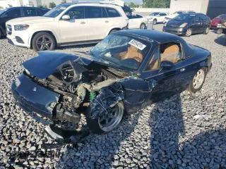 1995 Mazda MX-5 Miata z VIN JM1NA3531S0603470, wystawiony jako Copart lot #60294015 z przebiegiem 121 252 mil mil oraz Szkoda całkowita • Salvage title. Historia ofert i sprzedaży dostępna na DreamBid. Obrazek 1.