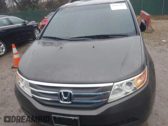 2012 Honda Odyssey EX-L with VIN 5FNRL5H6XCB057557, listed as a IAAI auction lot 42022410 with 174,286 mi miles and . Bid and sale history available at DreamBid. Image 12.