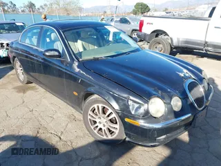2003 Jaguar S-Type with VIN SAJEA01UX3HM72928, listed as a IAAI auction lot 41703330 with 158,904 mi miles and . Bid and sale history available at DreamBid. Image 1.
