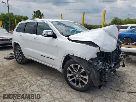 2017 Jeep Grand Cherokee Overland with VIN 1C4RJFCGXHC823593, listed as a Copart auction lot 58727205 with Not provided miles and Salvage title. Bid and sale history available at DreamBid. Image 4.