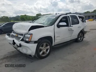 2012 Chevrolet Tahoe LS with VIN 1GNSCAE04CR258690, listed as a Copart auction lot 55443185 with 127,488 mi miles and Salvage title. Bid and sale history available at DreamBid. Image 1.