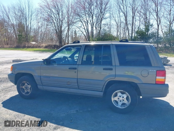 1997 Jeep Grand Cherokee Laredo with VIN 1J4GZ58S7VC713517, listed as a IAAI auction lot 42062214 with 205,533 mi miles. Bid and sale history available at carsss.com. Image 12.