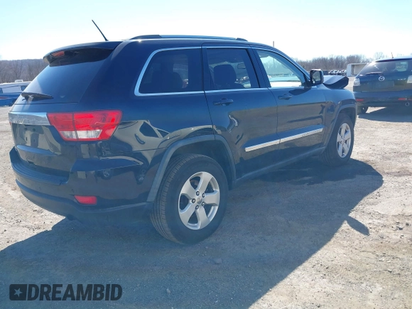 2011 Jeep Grand Cherokee Laredo with VIN 1J4RR4GG3BC670712, listed as a IAAI auction lot 41738127 with 93,714 mi miles and . Bid and sale history available at DreamBid. Image 4.