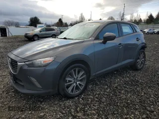 2017 Mazda CX-3 Touring with VIN JM1DKFC74H0176455, listed as a Copart auction lot 48825935 with 90,486 mi miles and Salvage Title. Bid and sale history available at carsss.com. Image 1.