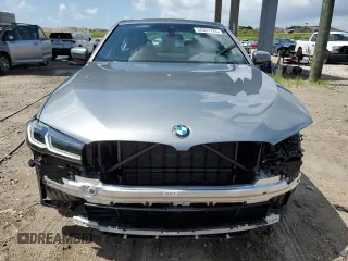 2023 BMW 5 Series 530i with VIN WBA53BH02PCM55841, listed as a Copart auction lot 58391765 with 6,947 mi miles and Salvage title. Bid and sale history available at DreamBid. Image 5.