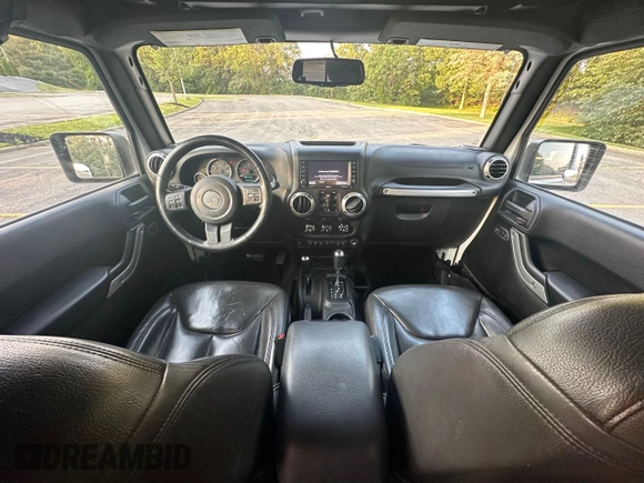 2016 Jeep Wrangler Unlimited Sahara with VIN 1C4BJWEG5GL215915, listed as a Copart auction lot 61690145 with 143,925 mi miles and Clean title. Bid and sale history available at DreamBid. Image 9.