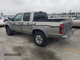 2000 Nissan Frontier XE with VIN 1N6ED27T8YC357939, listed as a Copart auction lot 55727395 with 143,842 mi miles and Salvage title. Bid and sale history available at DreamBid. Image 2.