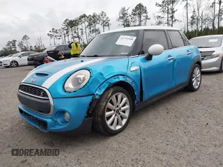 2017 MINI Hardtop 4 Door Cooper S z VIN WMWXU3C37H2F48944, wystawiony jako IAAI lot #41732140 z przebiegiem 154 563 mil mil oraz . Historia ofert i sprzedaży dostępna na DreamBid. Obrazek 17.